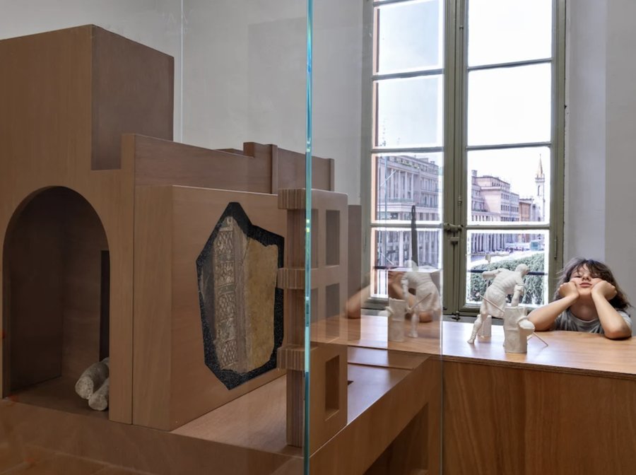 Palazzo dei Musei, Reggio Emilia, archaeological relief in wood-and-glass case with piazza view