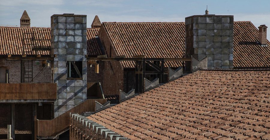 Palazzo della Podestà, Mantova, rooftop metal-clad chimney volumes